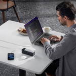 Anker 737 Power Bank 24000mAh 140W charging a laptop and mobile devices during work