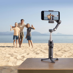 DJI Osmo Mobile 7P smartphone stabilizer capturing family moments on a beach
