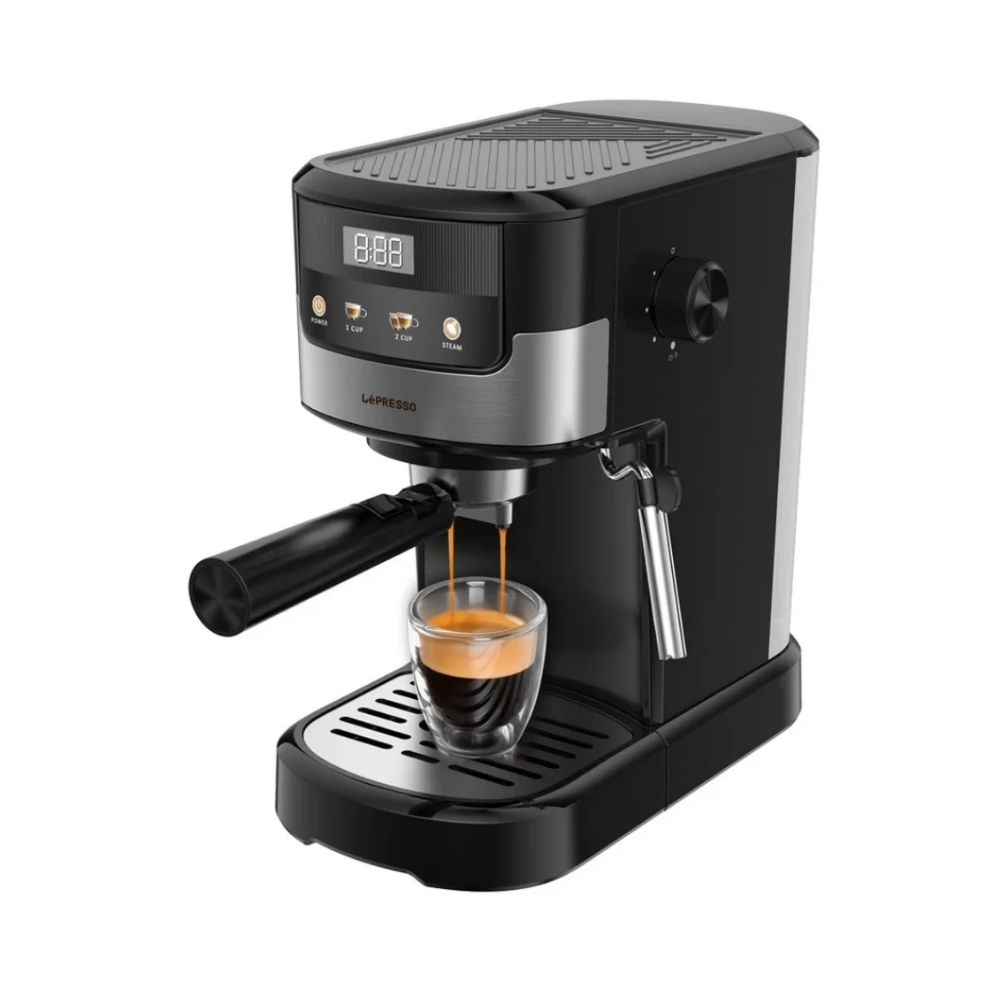 Black espresso machine with a glass of espresso on a white background