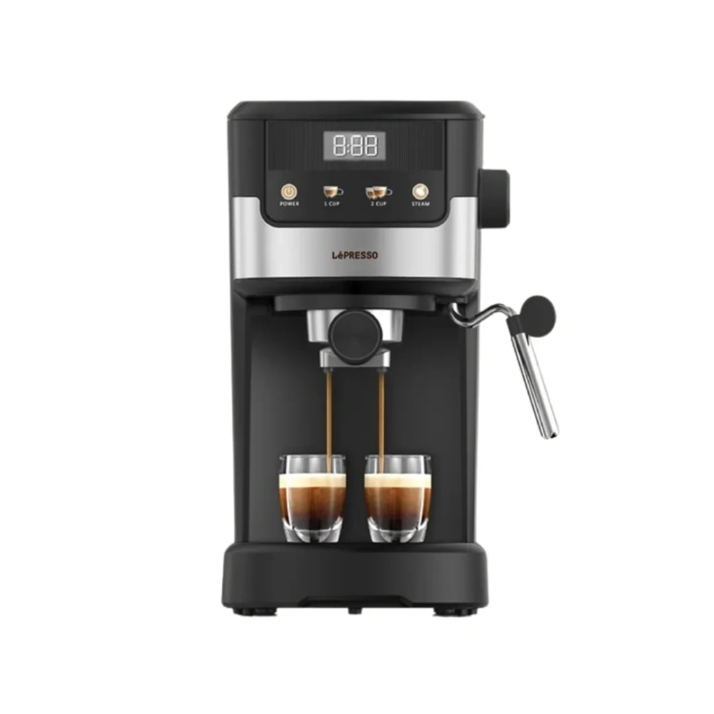 Black and silver LaPresso espresso machine with two glasses of coffee below on a white background