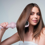 Woman styling hair using Porodo 5 in 1 hair dryer and curling tool