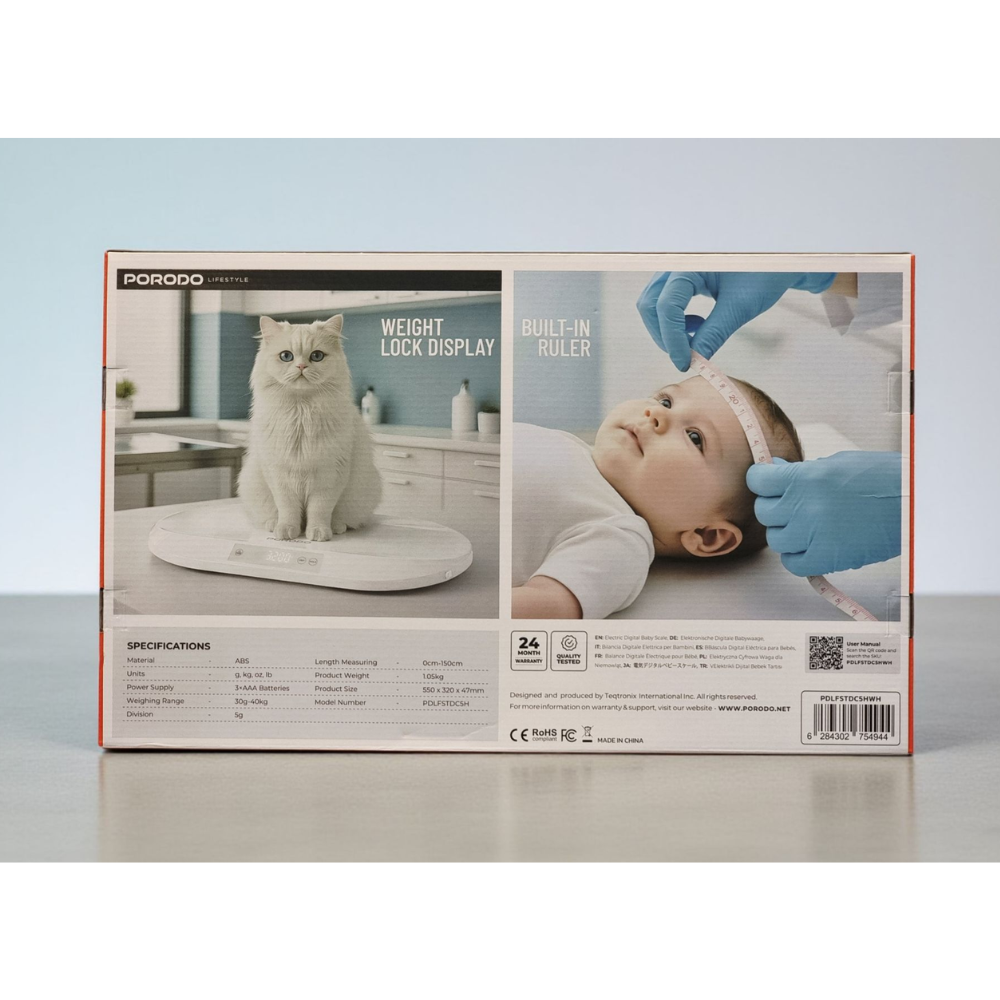 Product packaging for a baby weight scale with images of a cat and a baby on a gray surface.