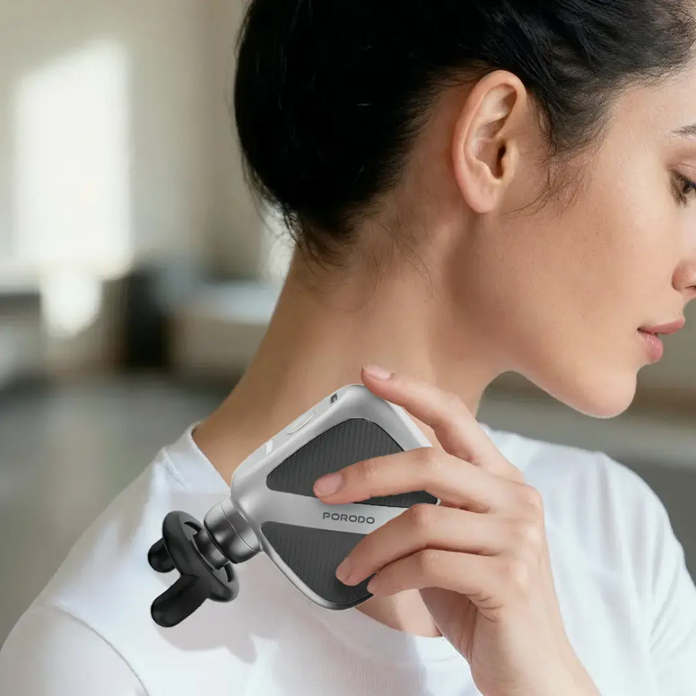 Woman using a handheld device on her neck with a blurred background